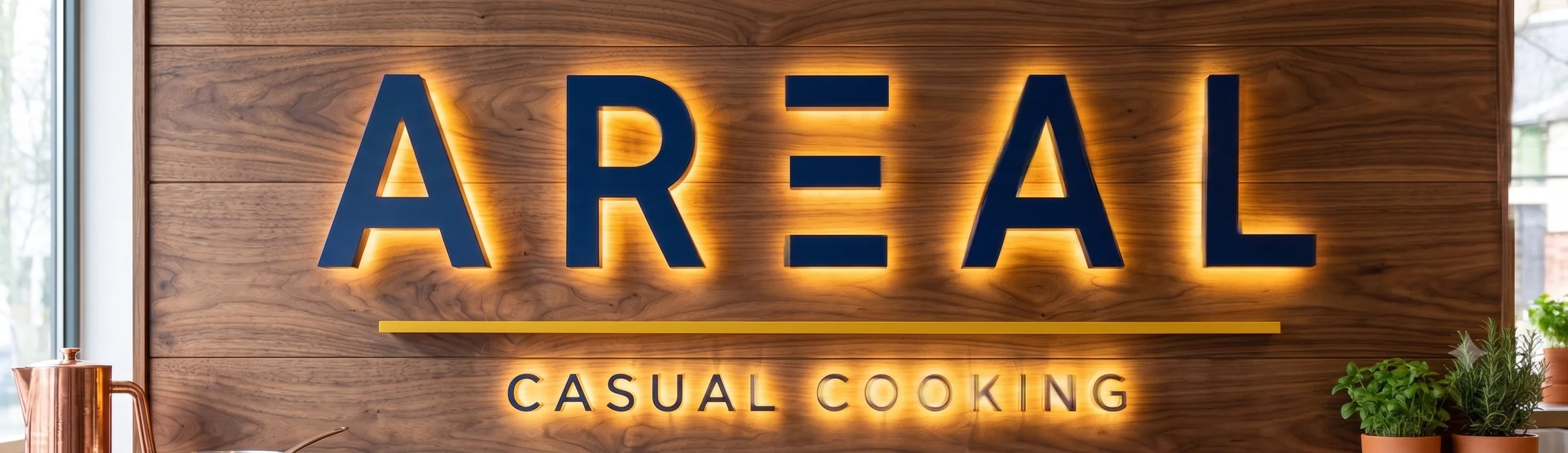 Rótulo AREAL Casual Cooking retroiluminado sobre panel de madera de nogal en un interior